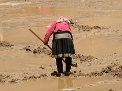 16 Woman Tilling A Wet Field In Yilik Village On The Way To K2 China Trek.jpg
